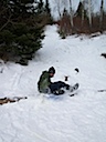 Sledding down the portage trail